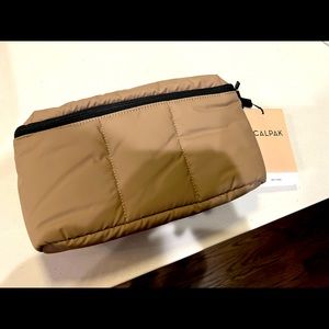 NWT never used Calpak Luka belt bag in Chocolate. Super soft. Adjustable belt.